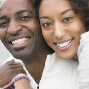 Close up of couple smiling --- Image by © Royalty-Free/Corbis